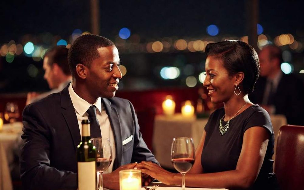 Two people at a dinner table